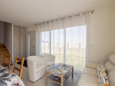 Coin salon dans l'établissement Holiday Home Tal ar Mor by Interhome