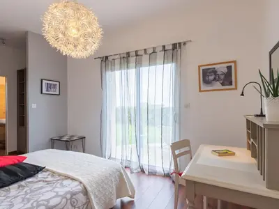 Un ou plusieurs lits dans un hébergement de l'établissement Holiday Home Maison de Plain Pied - Vue Mer by Interhome
