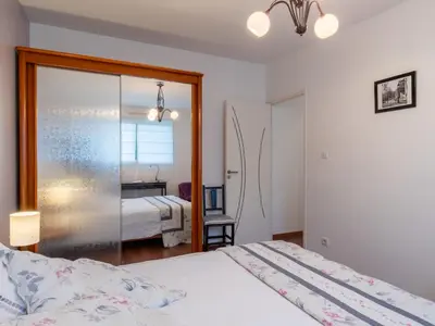 Un ou plusieurs lits dans un hébergement de l'établissement Holiday Home Maison de Plain Pied - Vue Mer by Interhome