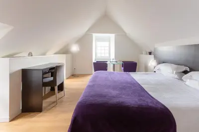 Un ou plusieurs lits dans un hébergement de l'établissement Hotel Le Temps De Vivre