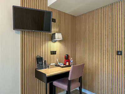 Télévision ou salle de divertissement dans l'établissement Hotel De La Gare