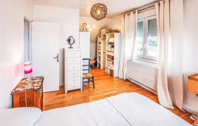 Un ou plusieurs lits dans un hébergement de l'établissement Cozy Home In Plouarzel