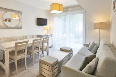 Coin salon dans l'établissement Résidence Vacances Bleues Les Jardins d'Arvor