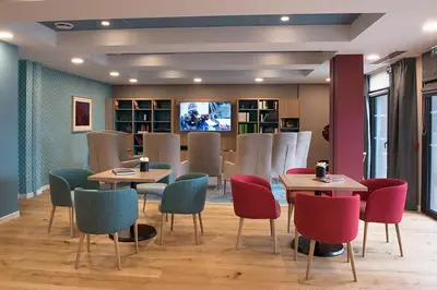 Télévision ou salle de divertissement dans l'établissement Domitys La Chaloupe Bleue
