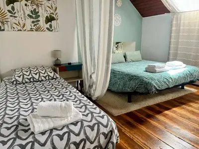 Un ou plusieurs lits dans un hébergement de l'établissement Duplex au lin