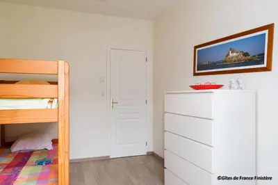 Un ou plusieurs lits dans un hébergement de l'établissement La maison du port