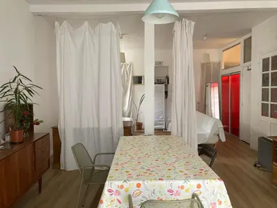Un ou plusieurs lits dans un hébergement de l'établissement Grand Studio Type Loft
