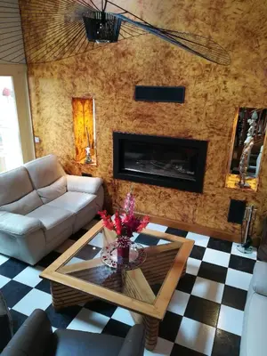 Coin salon dans l'établissement Chez Herveline Le Fer - Chambres et table d'hôtes
