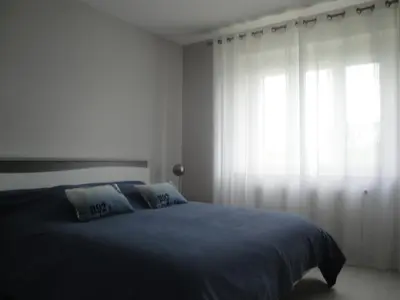 Un ou plusieurs lits dans un hébergement de l'établissement Maison de vacances
