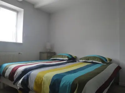 Un ou plusieurs lits dans un hébergement de l'établissement Maison de vacances