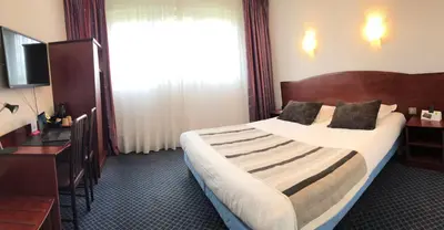 Un ou plusieurs lits dans un hébergement de l'établissement Hôtel Fontaine, Morlaix