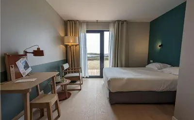 Un ou plusieurs lits dans un hébergement de l'établissement Logis le Castel Ac'h