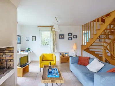 Coin salon dans l'établissement Holiday Home maison bleue by Interhome