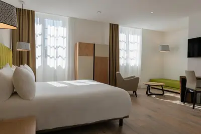Un ou plusieurs lits dans un hébergement de l'établissement Hôtel Ginkgo - SPA Biloba