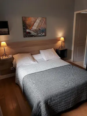Un ou plusieurs lits dans un hébergement de l'établissement Guest house Chante vent