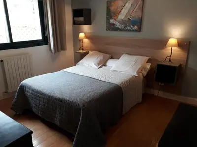 Un ou plusieurs lits dans un hébergement de l'établissement Guest house Chante vent