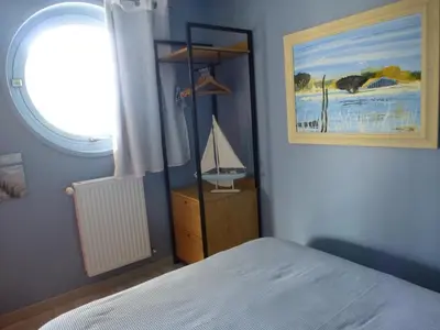Un ou plusieurs lits dans un hébergement de l'établissement La Maison Bateau au Bord de Mer