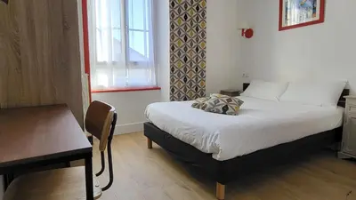 Un ou plusieurs lits dans un hébergement de l'établissement L'Hôtel de Loctudy