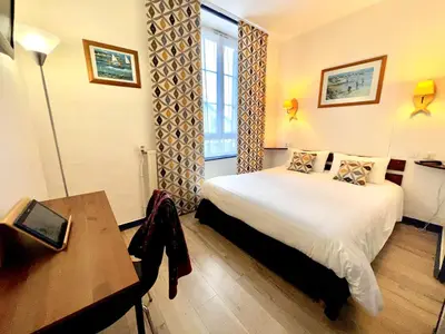 Un ou plusieurs lits dans un hébergement de l'établissement L'Hôtel de Loctudy