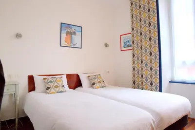 Un ou plusieurs lits dans un hébergement de l'établissement L'Hôtel de Loctudy