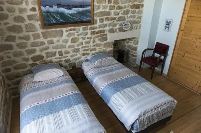 Un ou plusieurs lits dans un hébergement de l'établissement Comme à la Breizhon