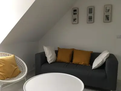 Coin salon dans l'établissement LA VILLE A LA MER N°3