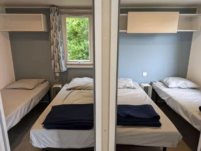 Un ou plusieurs lits dans un hébergement de l'établissement Camping de Lanven