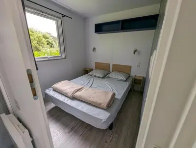 Un ou plusieurs lits dans un hébergement de l'établissement Camping de Lanven