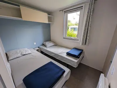 Un ou plusieurs lits dans un hébergement de l'établissement Camping de Lanven