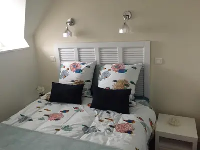 Un ou plusieurs lits dans un hébergement de l'établissement Appartements Duplex de Charme à Bénodet Vue Mer