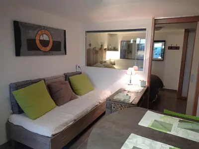 Un ou plusieurs lits dans un hébergement de l'établissement Appartement plein pied bord de mer