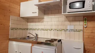 Cuisine ou kitchenette dans l'établissement Bungalow de Kermoal