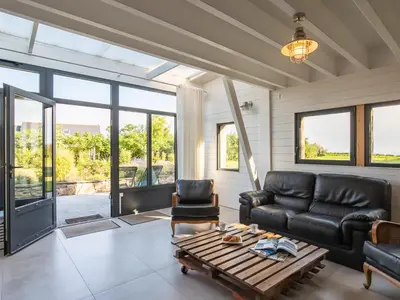 Coin salon dans l'établissement Chalet L'Atelier by Interhome