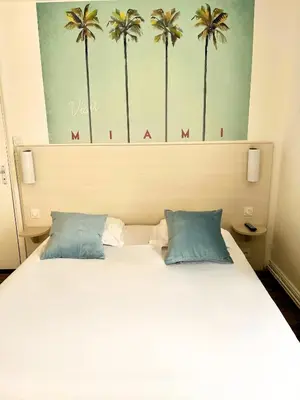 Un ou plusieurs lits dans un hébergement de l'établissement Hôtel Restaurant La Maison