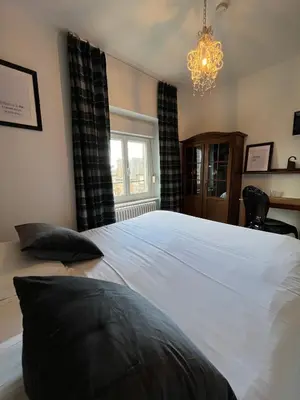 Un ou plusieurs lits dans un hébergement de l'établissement Hôtel Restaurant La Maison