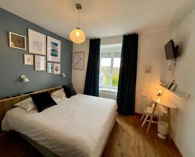 Un ou plusieurs lits dans un hébergement de l'établissement Hôtel Restaurant La Maison