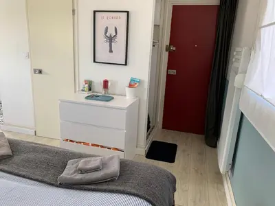 Un ou plusieurs lits dans un hébergement de l'établissement Appartement Design V Port de Tréboul-Douarnenez