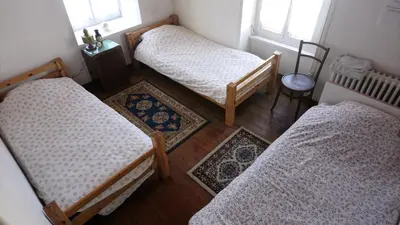 Un ou plusieurs lits dans un hébergement de l'établissement Chambre centre Pleyber-Christ