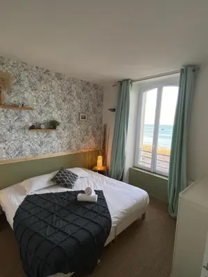 Un ou plusieurs lits dans un hébergement de l'établissement Le Château de Sable
