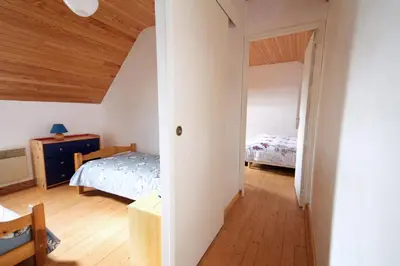 Un ou plusieurs lits dans un hébergement de l'établissement La Maison aux Volets Bleus de Prat An Ilis à 900m de la plage du Guilvinec
