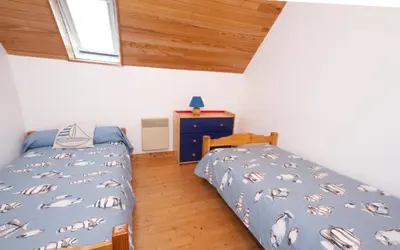 Un ou plusieurs lits dans un hébergement de l'établissement La Maison aux Volets Bleus de Prat An Ilis à 900m de la plage du Guilvinec