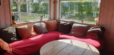 Coin salon dans l'établissement LE PETIT COIN DE PARADIS
