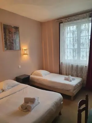 Un ou plusieurs lits dans un hébergement de l'établissement Hotel Kelig