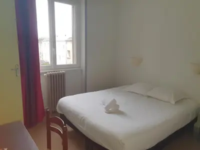 Un ou plusieurs lits dans un hébergement de l'établissement Hotel Kelig