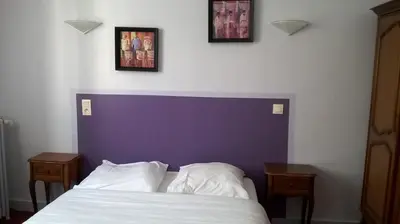 Un ou plusieurs lits dans un hébergement de l'établissement Hotel Kelig