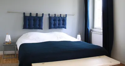 Un ou plusieurs lits dans un hébergement de l'établissement Maison Boulvern