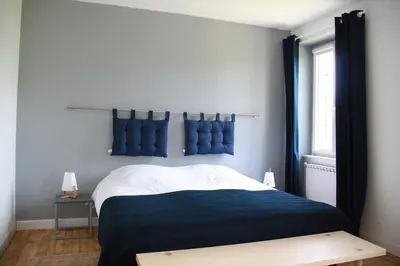Un ou plusieurs lits dans un hébergement de l'établissement Maison Boulvern