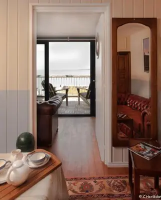 Coin salon dans l'établissement Hôtel Kermor