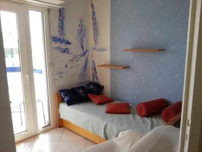 Un ou plusieurs lits dans un hébergement de l'établissement Charme et Océan face à la plage