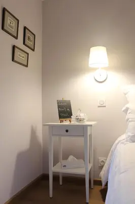 Un ou plusieurs lits dans un hébergement de l'établissement Manoir du Moustoir - Hôtel Les Empreintes